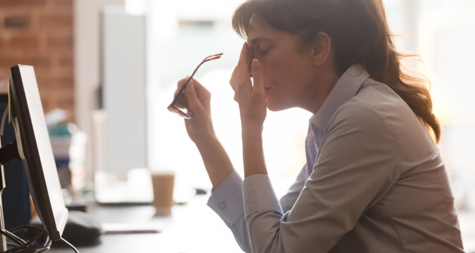 Woman at work experiencing creative burnout